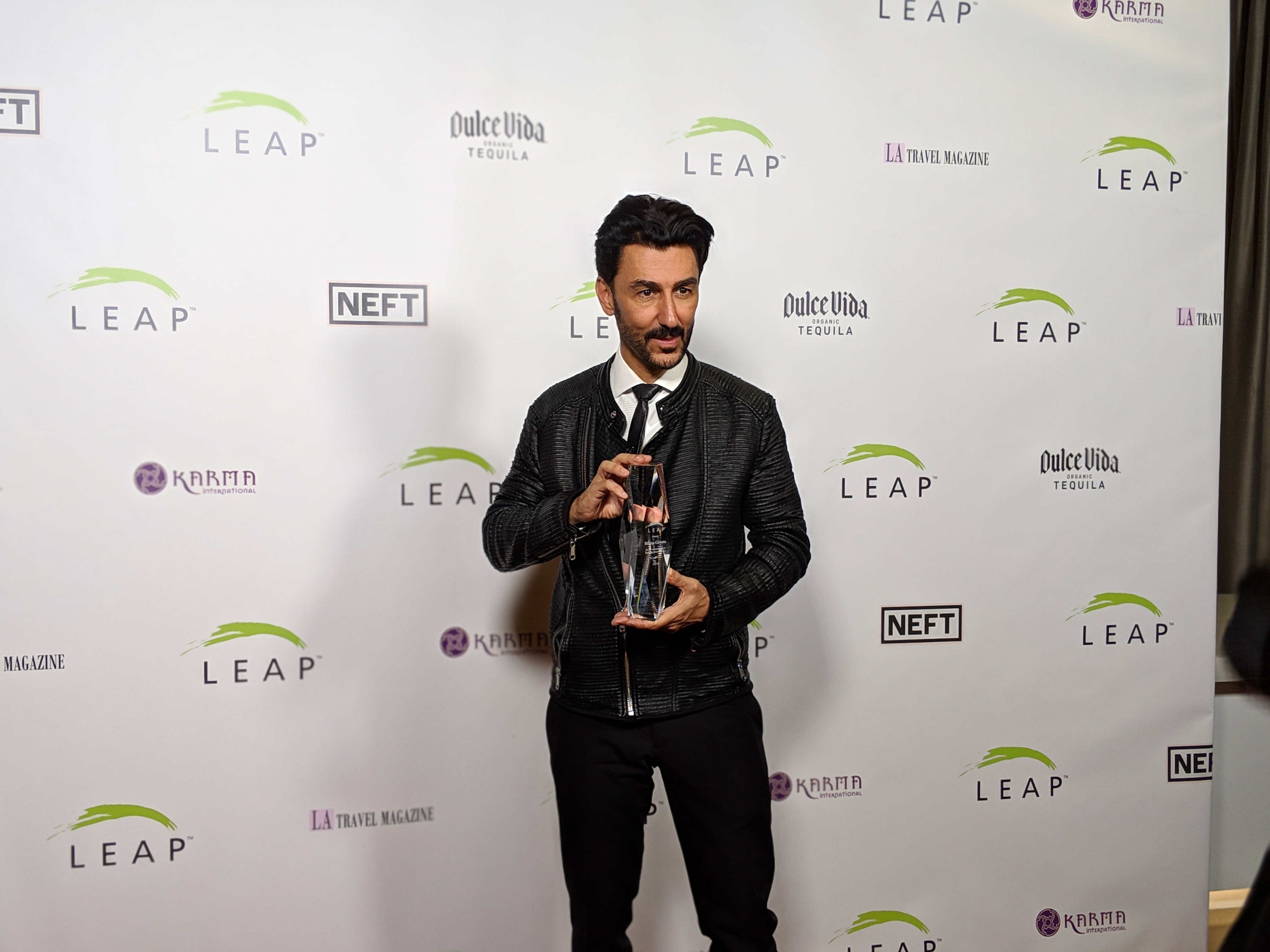 Bibop Gresta with LEAP award trophy